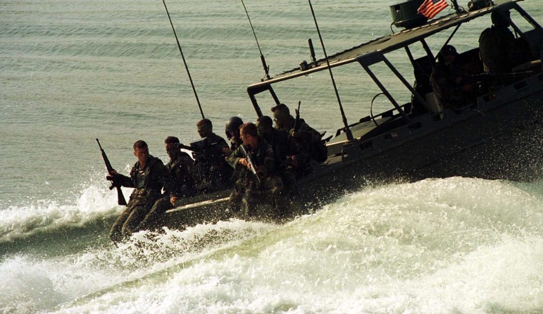 960620-M-0707S-001 Marines from 2d Reconnaissance Company ride on a Riverine Assault Craft from 2d Small Craft Company prior to casting into the water during the hostage rescue portion of Preying Mantis II. Praying Mantis II was a Headquarters Battalion, 2d Marine Division field exercise conducted at Camp Lejeune, NC. During this two week long exercise, Headquarters Battalion Marines conducted evolutions to include Mass Casualty drills, Hostage Rescue drills, and operations in support of Small Craft Company, performing its riverine function. 2d Marine Division Combat Camera imagery by LCpl. M.A. Sunderland.