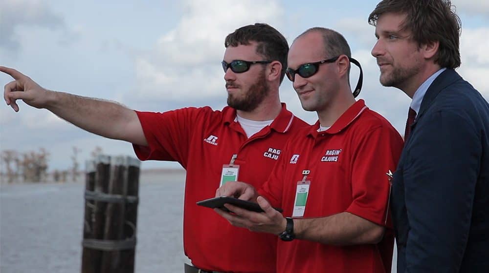 MVI_1333-4-UL-Guys-Hovering-Over-iPad-WS